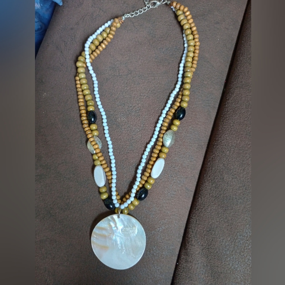 Elegant Multi-Strand Beaded Necklace with Shell Pendant